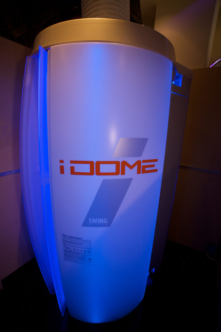 A white and blue stand with the word " idome 7 ".