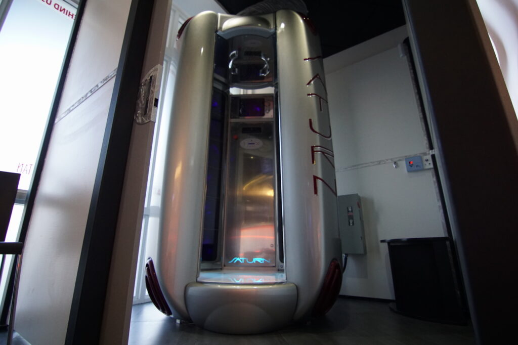 A silver inflatable object in the middle of a room.