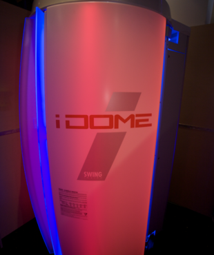 A white and red lighted pedestal with the word 