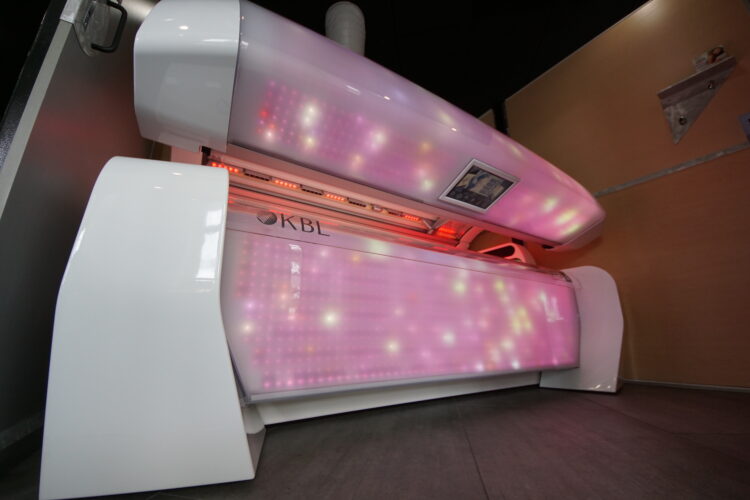 A tanning bed with lights on it
